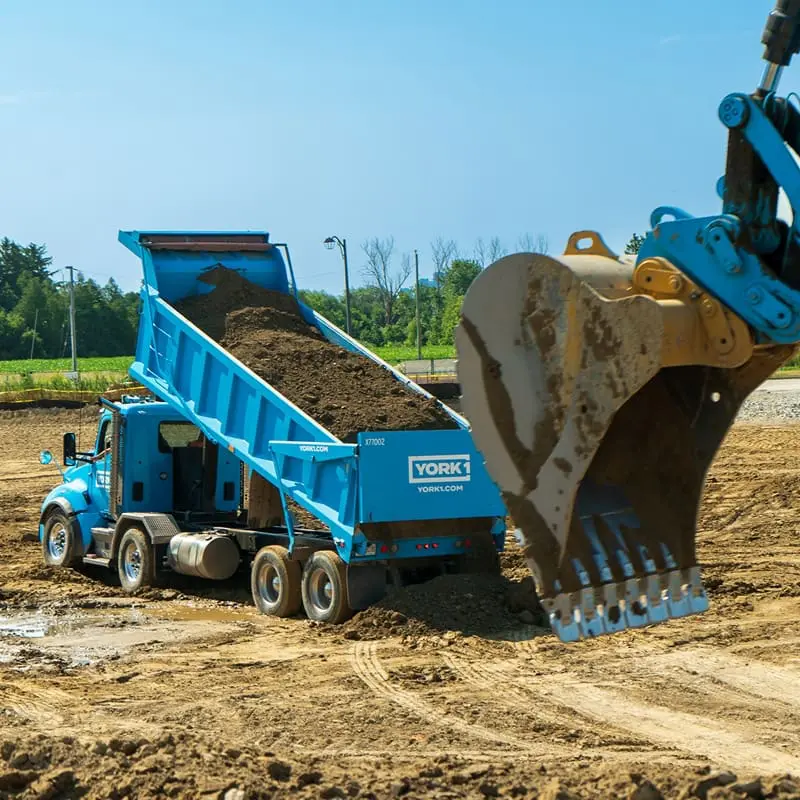 YORK1 cyan dump truck full of soil