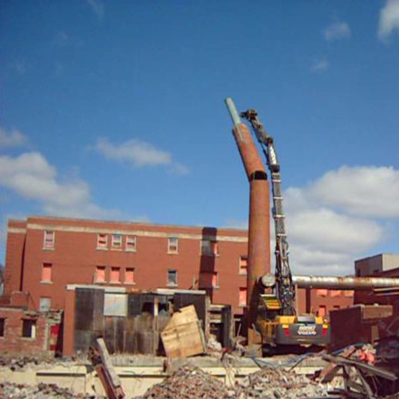 Chimney stack removal during Grace Hospital Demolition project in Windsor Ontario