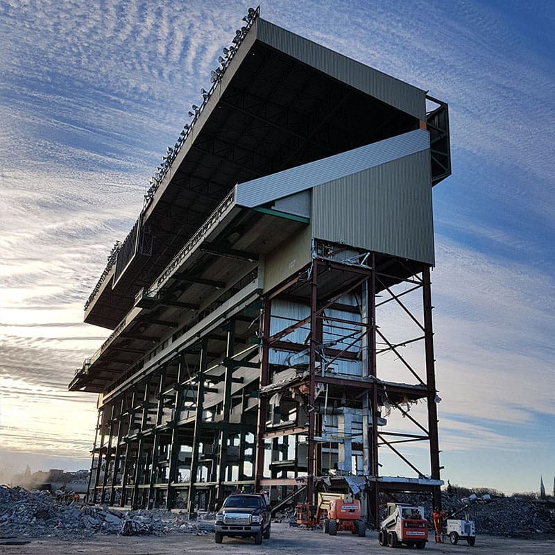 Mosaic stadium demolition project at dawn