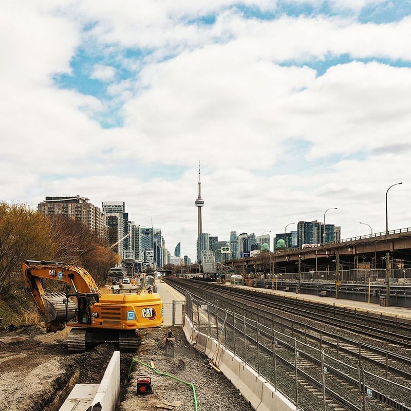 Excavation work for Metrolinx with the Toronto skyline in the background