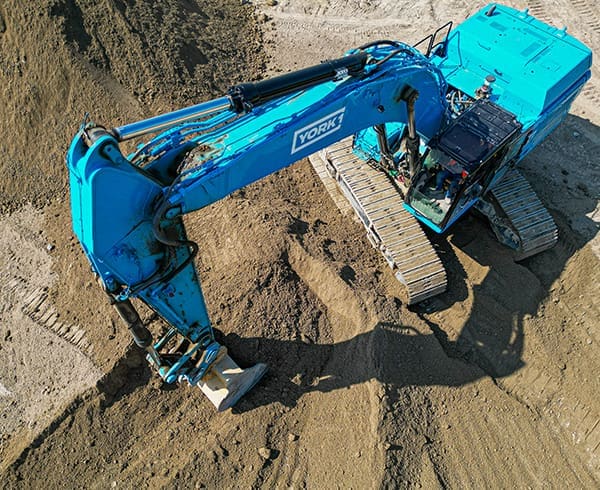 YORK1 Excavator digging in the soil