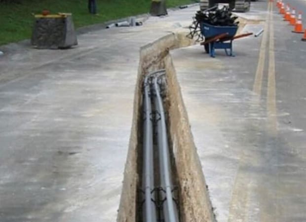 Installation of Underground Utilities Conduit pipes placedin a trench