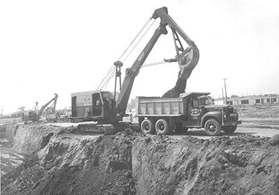 Black and white shot of machinery on a job site in 1950