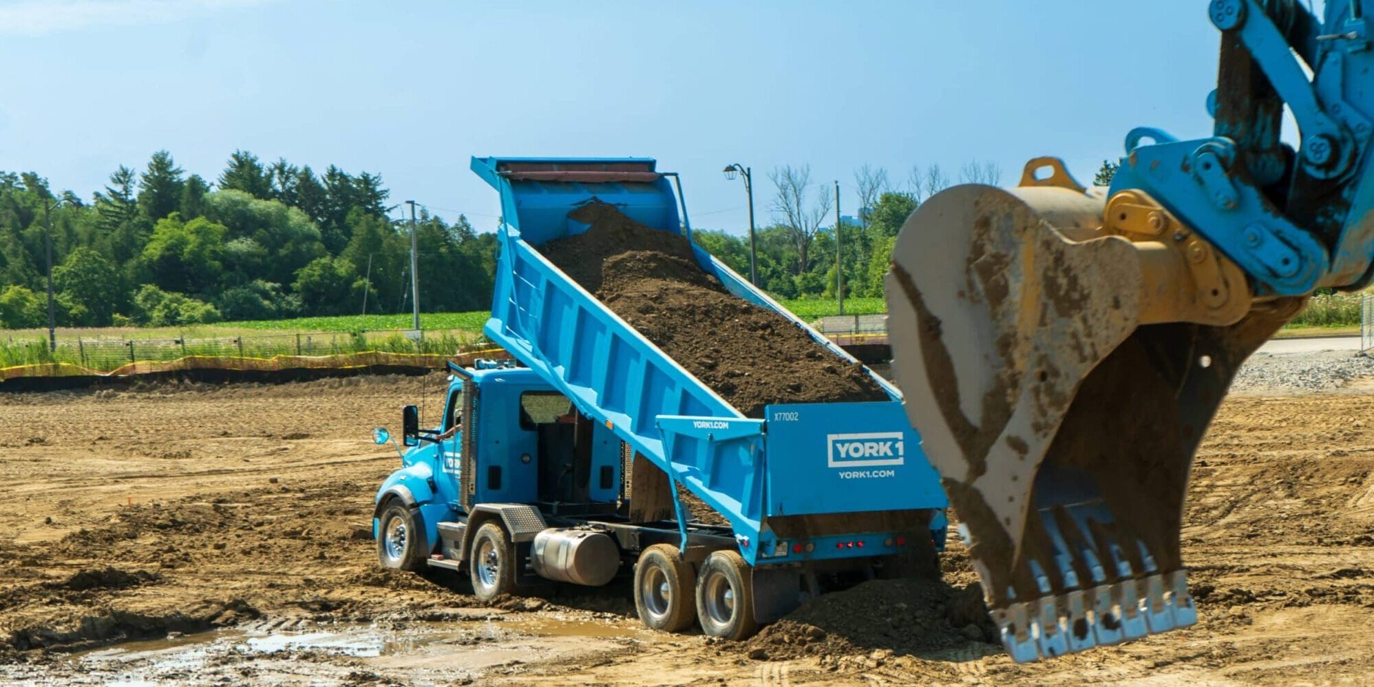 YORK1 cyan dump truck full of soil