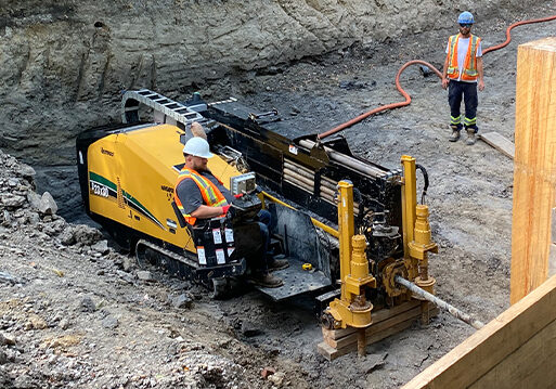 An employee operating a directional drilling machine at a York1 site.