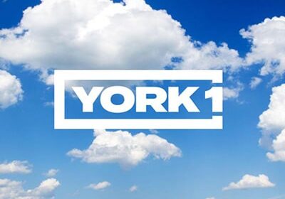 York1 logo over image of blue sky and clouds.